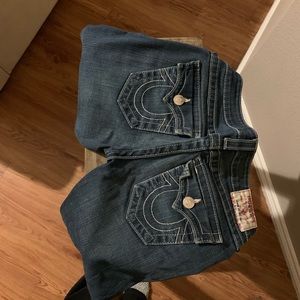 Dark blue true religion jeans.